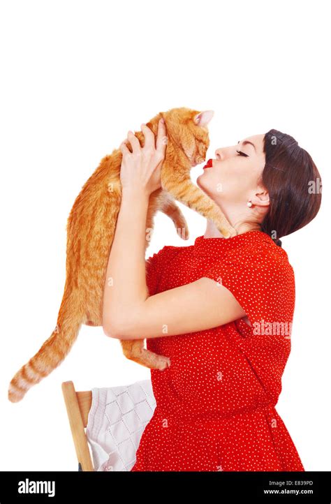 Beautiful Brunette Girl Kissing A Red Cat Stock Photo Alamy