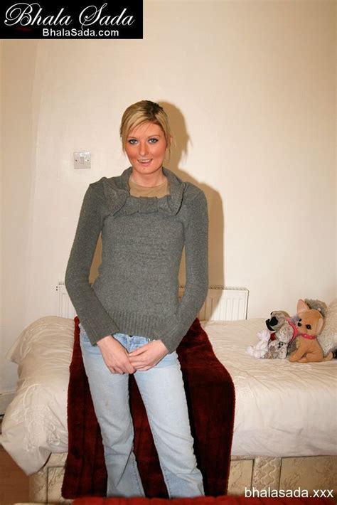 Sweet Blonde Chick Posing In A Shirt And Jeans Photos