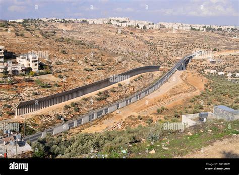 The up to 8m high wall dividing Israel and the Palestinian West Bank