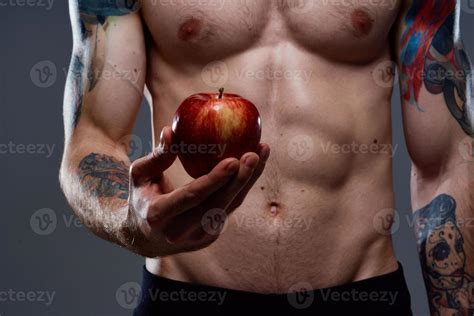 Nude Bodybuilder With Pumped Muscles And Tattoo Apple In Hand Health Stock Photo At