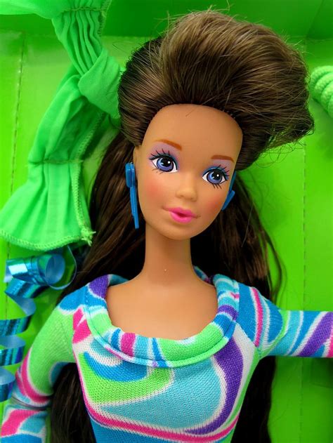 A Close Up Of A Barbie Doll With Long Hair And Blue Eyes Wearing A