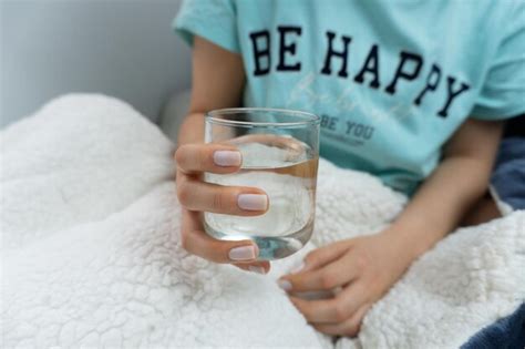 Premium Photo Girl Holding Glass With Water