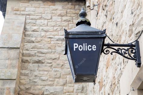 Premium Photo | Blue police sign on stone wall background