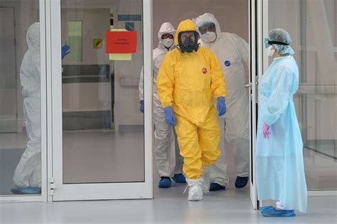 Putin dons hazmat suit, as Russia admits virus numbers likely far ...