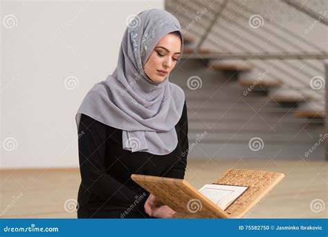 Woman Praying In Mosque And Reading The Quran Stock Photo Image Of