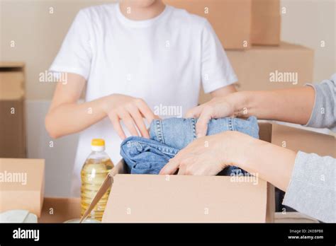 Volunteers Collect Donations For Charity Indoors Donation Boxes With