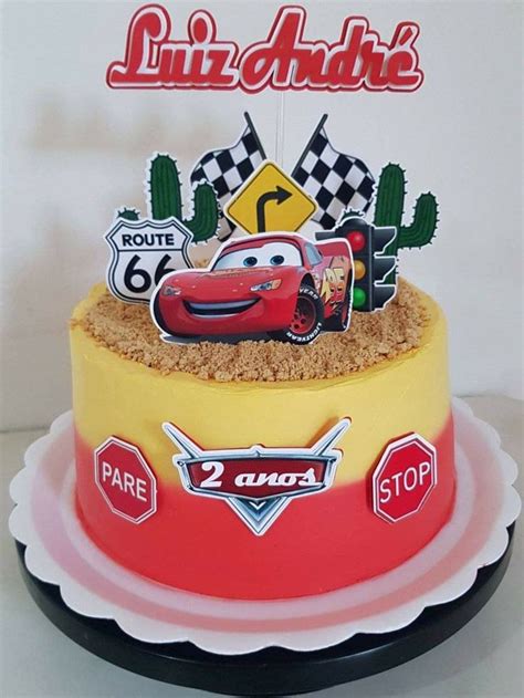 A Birthday Cake Decorated With Cars And Signs