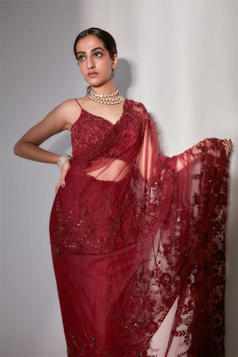 Hand Embroidered Burgundy Saree With Perfect Detailing Complemented With Elegant Peplum Skirt