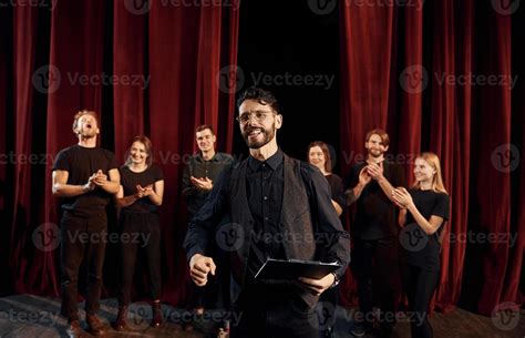 Man Is Practicing His Role Group Of Actors In Dark Colored Clothes On