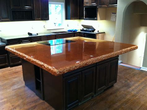 Stained concrete countertop on kitchen island with built-in cooktop ...