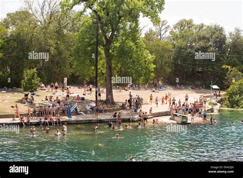 People Swim In The Outdoor Swimming Pool At Barton Springs Pool In