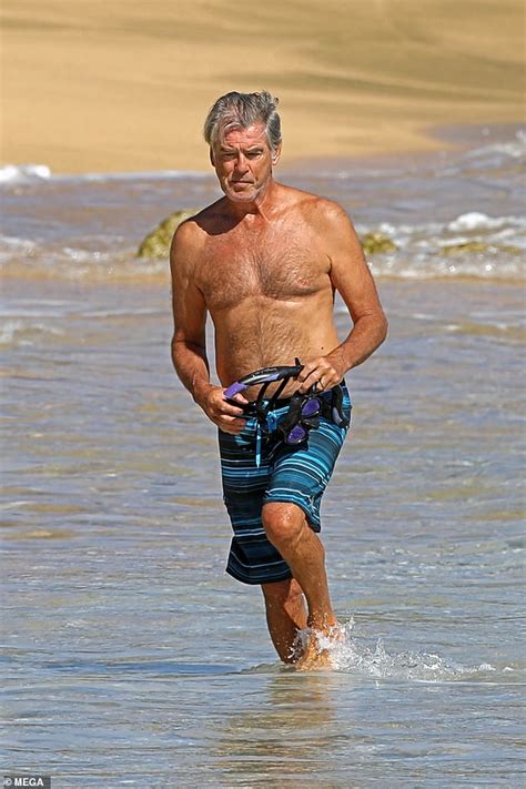 Shirtless Pierce Brosnan Gives Wife Keely Shaye Smith A Kiss As They Enjoy A Beach Day In Hawaii