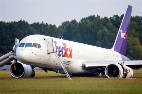 FedEx plane without landing gear skids off runway, but lands safely at ...