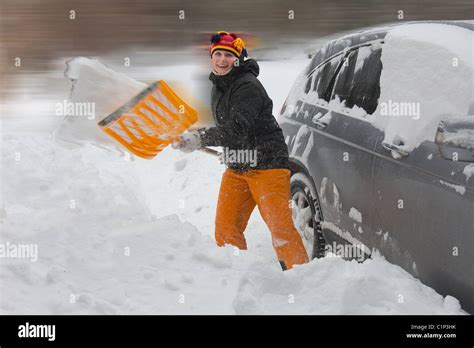 Digging Out A Snow Covered Car