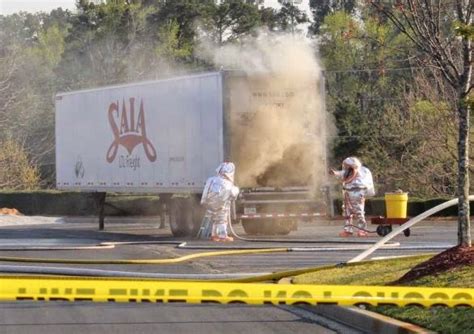 MEC F Expert Engineers FIREFIGHTERS DOUSE CHEMICAL FIRE IN THE BACK