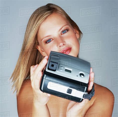 Naked Blond Woman Holding A Camera Stock Photo Dissolve