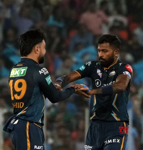 Ahmedabad Gts Bowler Rashid Khan With Team Captain Hardik Pandya Celebrate The Dismissal Of