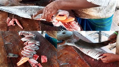 Cutting Slicing Two Spanish Mackerel Fish With Eggs Seer Fish