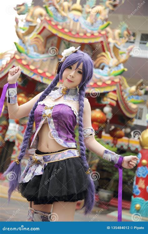 Portrait Of Asian Young Woman Dancing With Purple Chinese Dress Cosplay