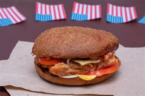 Composition With American Flag And Hamburger On Dark Background