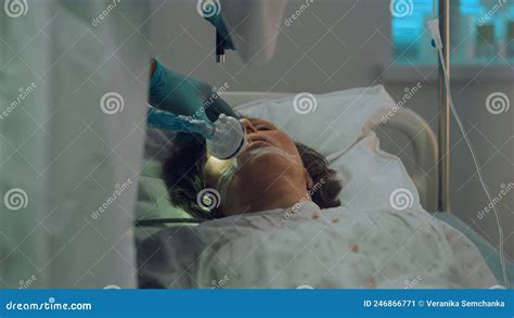 Ill Patient Breathing Oxygen Mask Hospital Bed Doctor Test Light