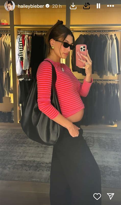 Pregnant Hailey Bieber Strips Down To Show Her Bare Bump In Bandana Top