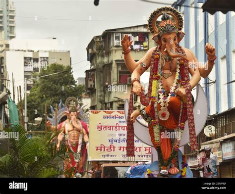 MUMBAI INDIA SEPTEMBER 12 Devotees March With Idols Of Lord Ganesh