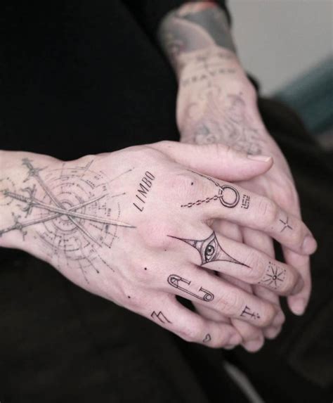 Keshi's finge composition tattoos.