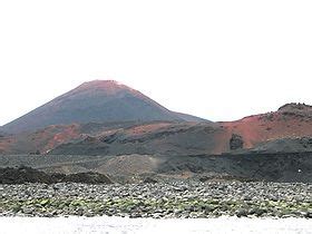 Eldfell volcano near the town of Heimaey. Eruption 1973 threatened town ...