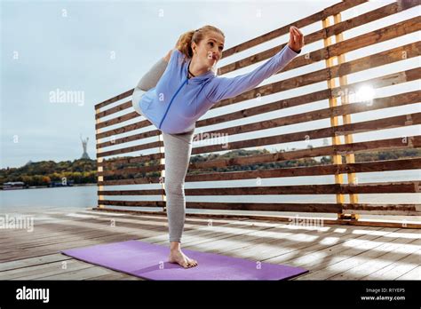 Female Yogi Balancing On The One Leg While Doing Asanas Stock Photo Alamy