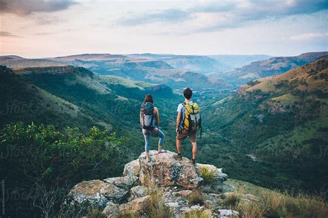 "Hiking Couple Outdoors In Nature" by Stocksy Contributor "Juno" - Stocksy