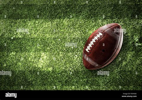 Rugby ball on grass Stock Photo - Alamy