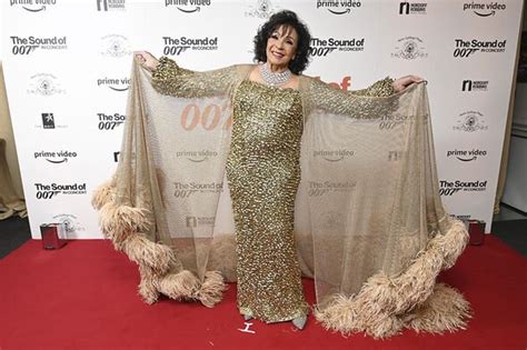 Shirley Bassey 85 Oozes Glamour In Sequin Gold Gown And Feather Cape For James Bond Show