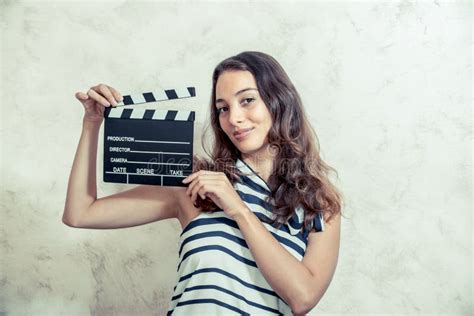 Woman Smiling With Clapper Board Movie Audition Concept Stock Photo