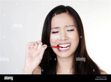 Picture Of Lovely Woman With A Hot Fresh Chilli Stock Photo Alamy