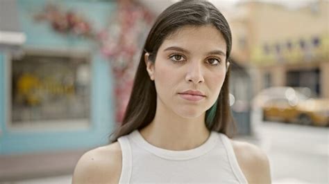 Premium Photo Young Beautiful Hispanic Woman Standing With Serious