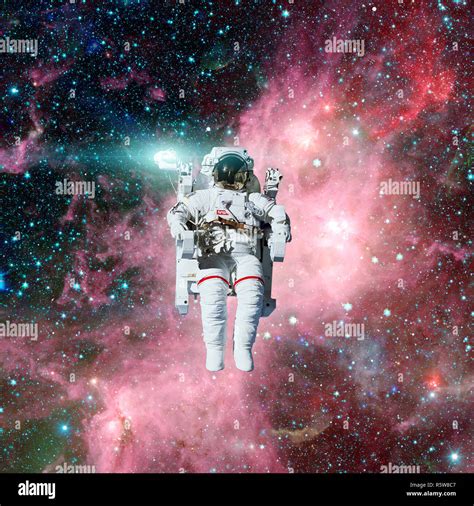 Astronaut in outer space. Nebula and stars on the background Stock ...