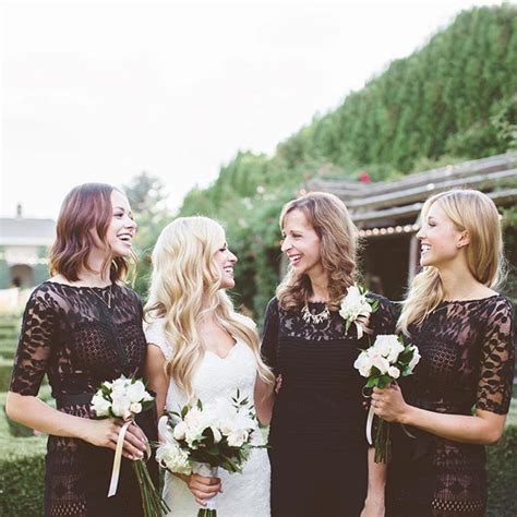 Three Beautiful Women Standing Next To Each Other In Front Of A House