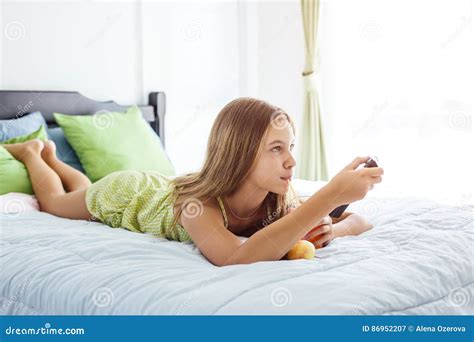 Girl Drinking Juice And Watching Tv In Bedroom Stock Image Image Of