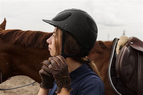 "Woman Wearing Helmet For Horseriding" by Stocksy Contributor "Milles ...