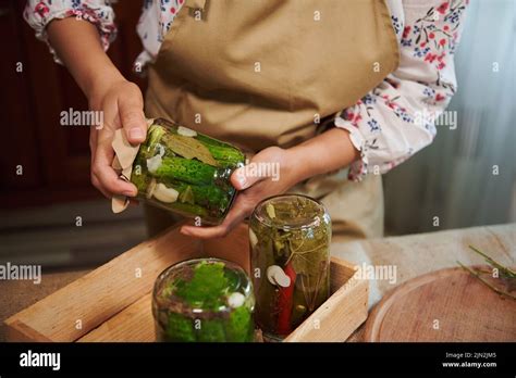 Details Female Housewifes Hands Holding A Glass Jar Of Pickled