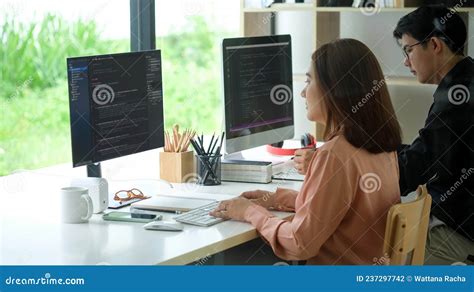 Side View Of Female Programmer Working With Computer At Modern Office