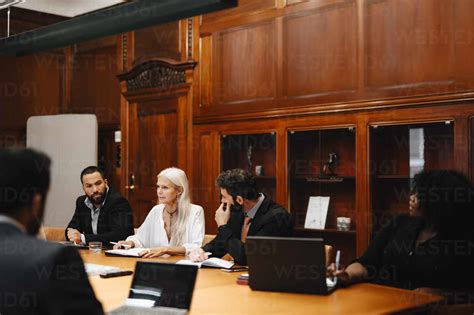 Male And Female Financial Advisors Discussing In Conference Meeting In