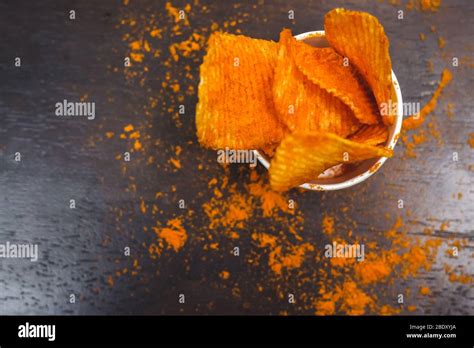 Crisps Hot And Spicy Potato Chips On Top View Potato Chips Ready To Eat On The Table With Green