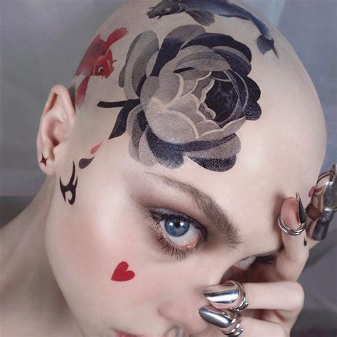 bald head tattoo woman - Gerda Nye