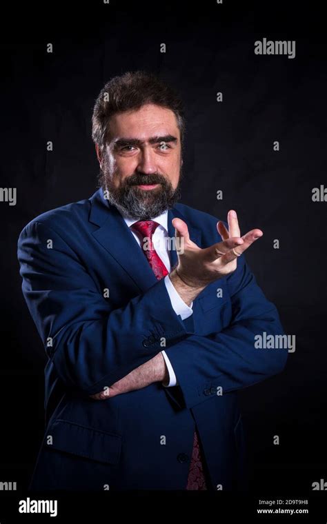 Mature Businessman Dressed In Blue Suit With Red Tie Studio Portrait Stock Photo Alamy