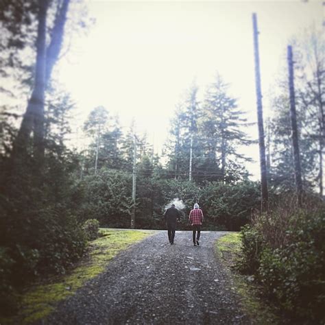 Premium Photo Rear View Of People Walking On Road Against Trees