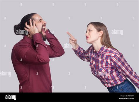 Profile side view portrait of angry woman standing and blaming at ...