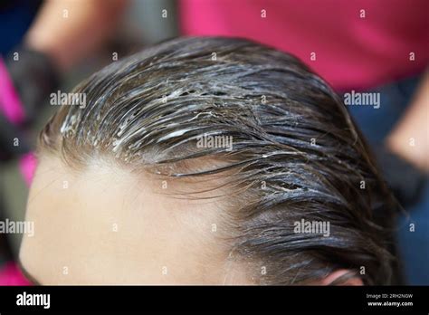Female hair with applied bleach for hair dye Stock Photo - Alamy