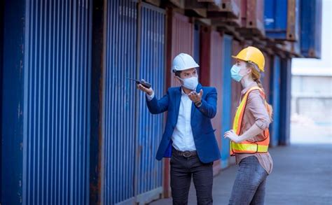 Premium Photo | Portrait team dock workers posing under working and ...